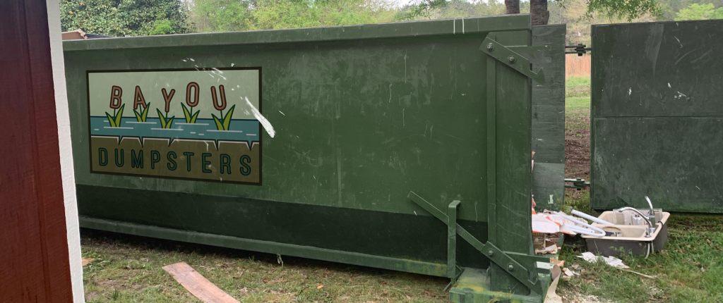 exterior of a roll off dumpster being loaded