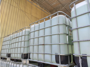 A picture of portable water tanks lined up next to each other.